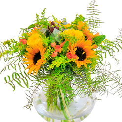 The first impression of this Barbican bouquet is sheer sunlit exuberance, echoing the bright, open piazzas and contemporary lines of the neighbourhood. Sunflowers blaze at the center, each golden petal unfurling towards the light with unmatched vitality. Nestled beside them, lush yellow roses spiral in precisely gathered layers, their texture velvet-soft and welcoming. Across the arrangement, vibrant red Hypericum berries shimmer-providing a lively accent that contrasts beautifully with the deep emerald greens enveloping each bloom. Feathery ferns and soft vines cascade with natural grace, conjuring the lush terraces and hidden gardens of the Barbican. Delicate yellow filler and slender green spikes add dimension and playful movement, while bluish eucalyptus leaves bring modern coolness and a faint, fresh scent. All these elements lie cradled in a polished, spherical glass vase, its clarity highlighting every submerged stem and the clean serenity of fresh water. Caught in the quiet of Barbican's late afternoon light, this bouquet beams with hope and celebration, perfect for commemorating birthdays, anniversaries, or simply sending sunshine to someone special. In every stem, you'll find a bit of Barbican's creative flair and architectural grace, delivered straight from our local florist's hands to yours.